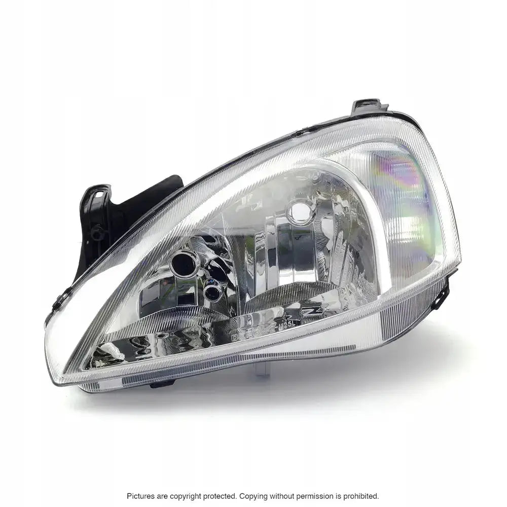 Hovedlykter Opel Combo 00-10 H7 med klart deksel, krom reflektor og svarte festedetaljer, sett skrått forfra.