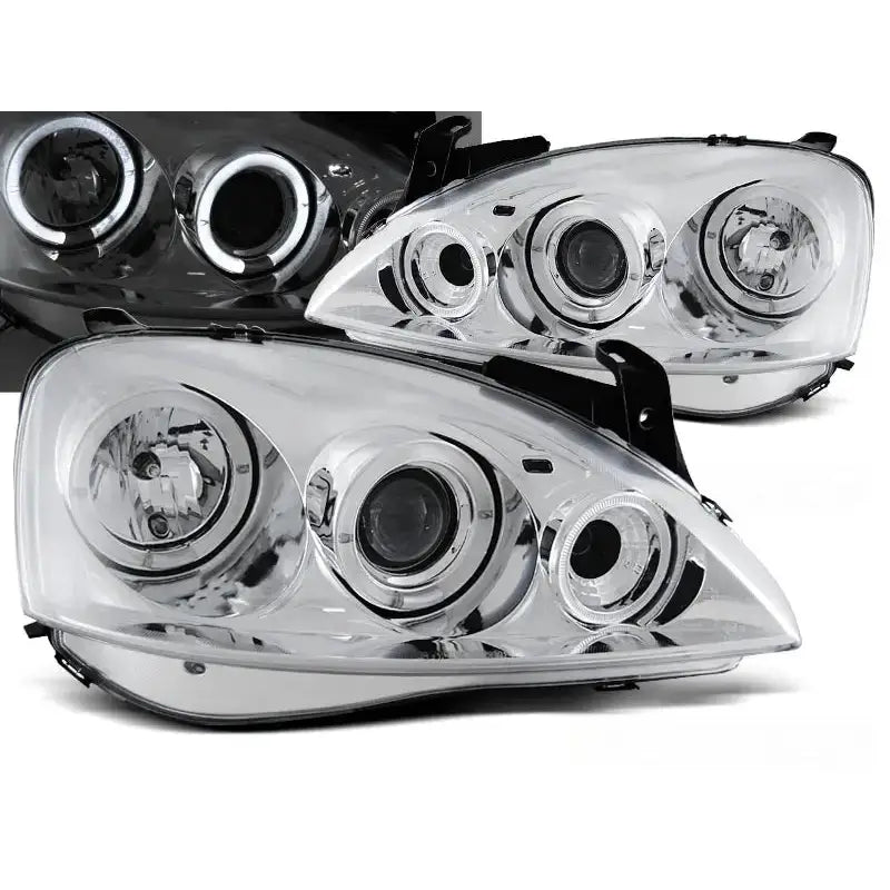 Frontlykter Opel Corsa C Angel Eyes Chrome med klar linse og LED-ring, sett forfra i vinkel.