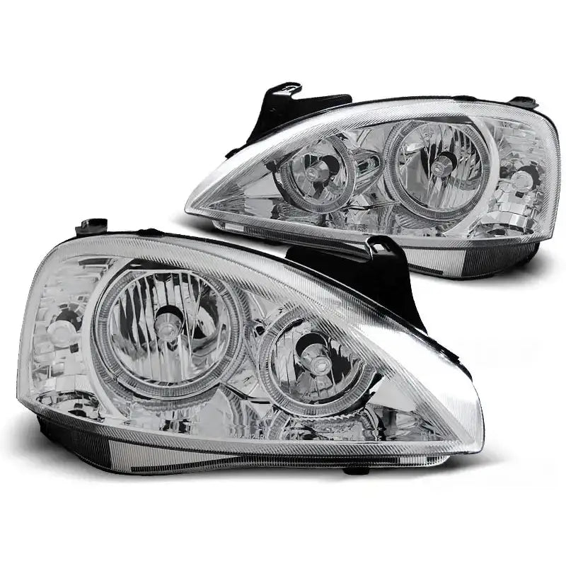 Hovedlykter Opel Corsa C Angel Eyes Chrome med klart glass og kromdetaljer, sett fra skrå frontvinkel.