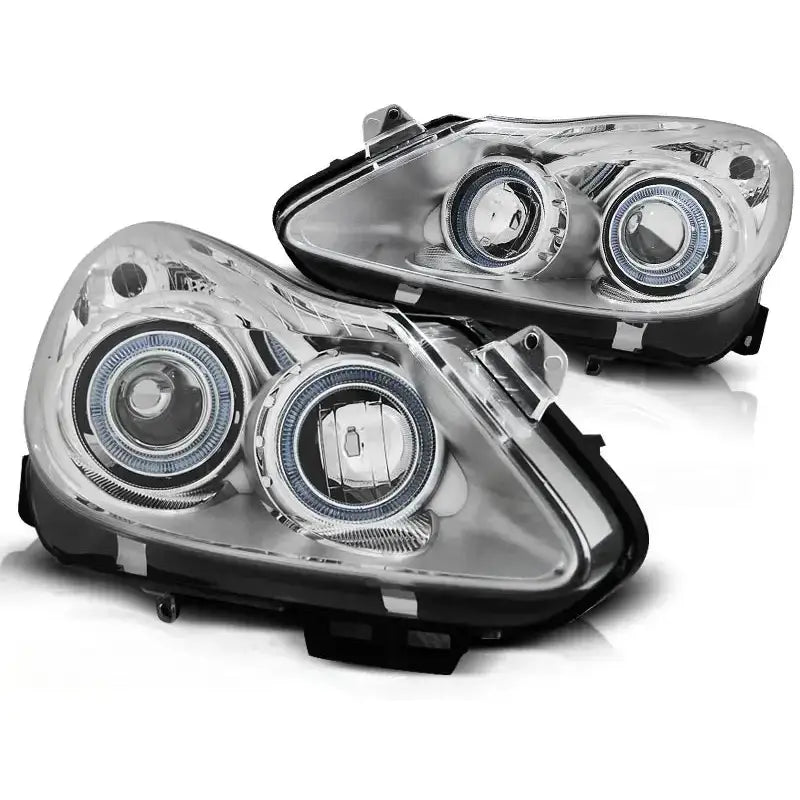Hovedlykter Opel Corsa D Angel Eyes Chrome med to runde linser og LED-lysringer, sett forfra.