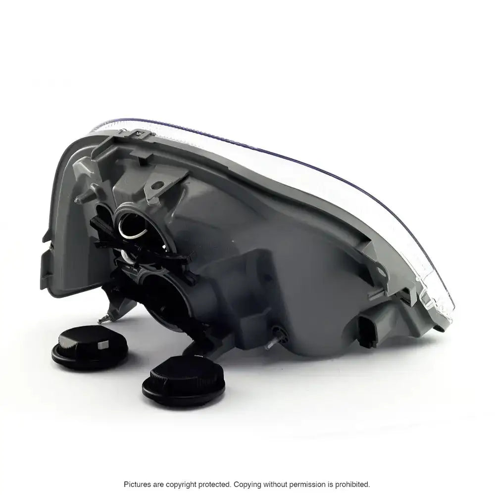 Headlights Opel Movano 04-10 sett fra undersiden med sorte deksler og monteringsfester mot hvit bakgrunn.