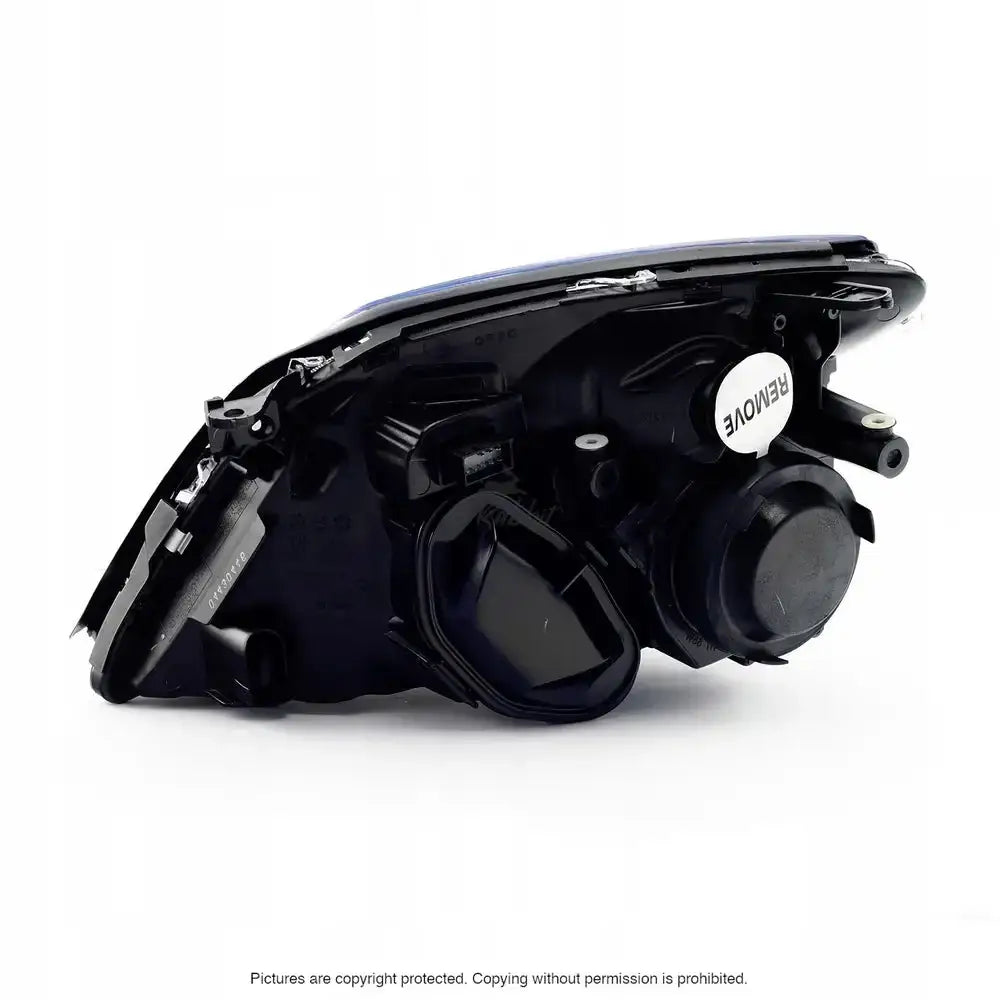 Hovedlys Opel Signum 02-05 H7 Chrome sett fra baksiden med deksel og hvit etikett på hvit bakgrunn.