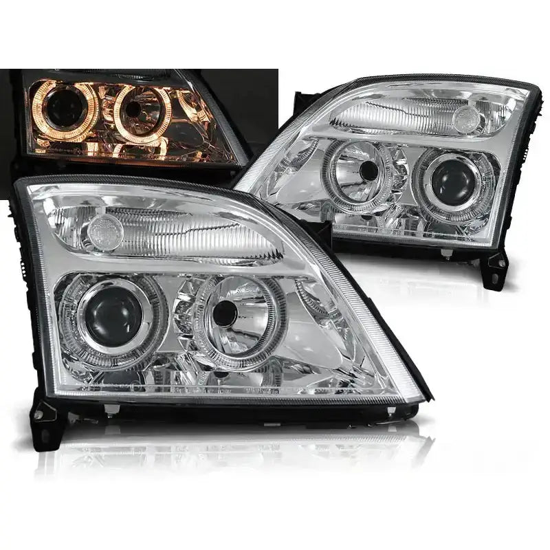 Frontlykter Opel Vectra C Angel Eyes Chrome med doble linser og oransje lysring fra skrå vinkel.