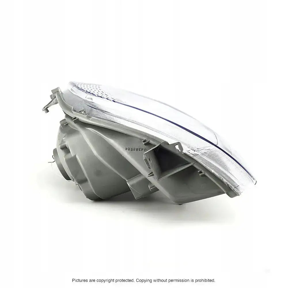 Hovedlys Opel Vivaro 01-07 vist fra siden, med synlig bakside og kant av lykteglass i plast og glass.