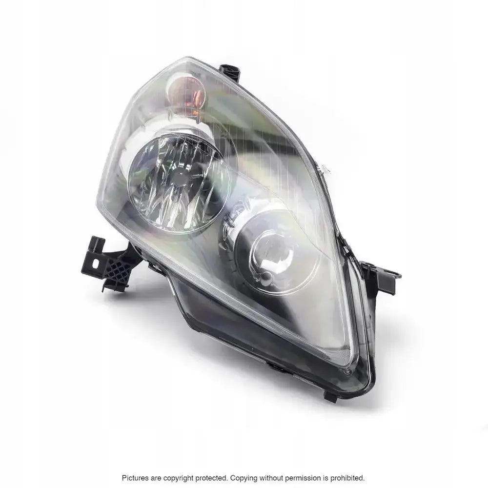 Frontlykter Opel Zafira B 05-08 H7/H1 vist skrått forfra med reflektorer og monteringsfester.