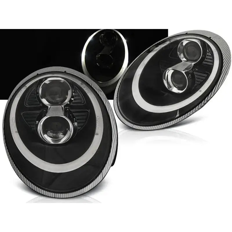 Frontlykter Porsche 911 997 Black Xenon med ovale linser, LED-lysring og to hovedlys, front- og skråperspektiv.