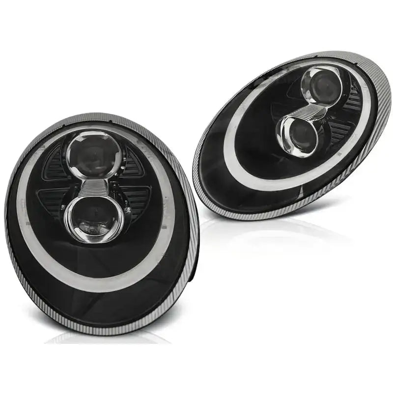 Hovedlykter Porsche 911 997 04-09 Black Xenon med to runde linser og LED-ring, fotografert skrått.