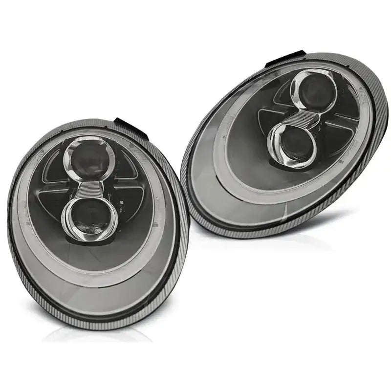 Hovedlykter Porsche 911 997 sølv xenon, sett fra skrå vinkel med detaljerte reflektorer og linser.