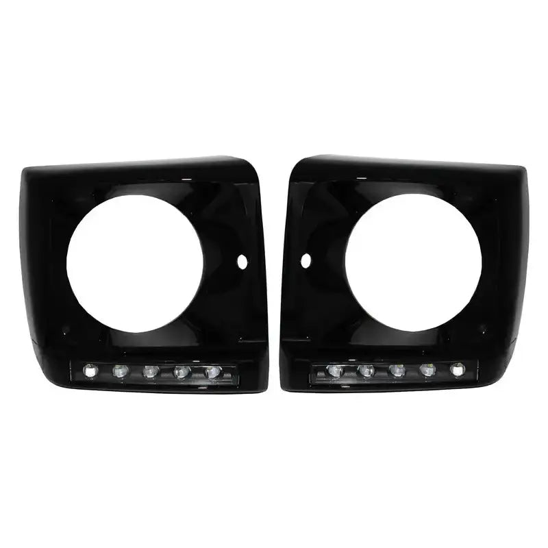 Hovedlykter ramme til Mercedes Geländewagen W463 med svarte deksler og fire LED-lys nederst, sett forfra.