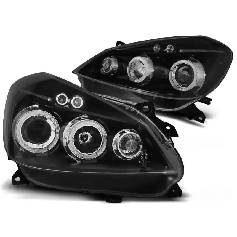 Hovedlykter Renault Clio 3 Black Angel Eyes med sølvreflektorringer og klare linser, sett skrått forfra.