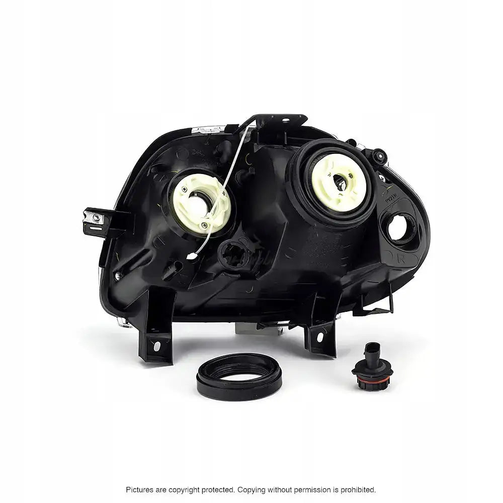 Headlamp bakside av frontlykter til Renault Clio II 98-01 med synlige pæreåpninger og separate deler.