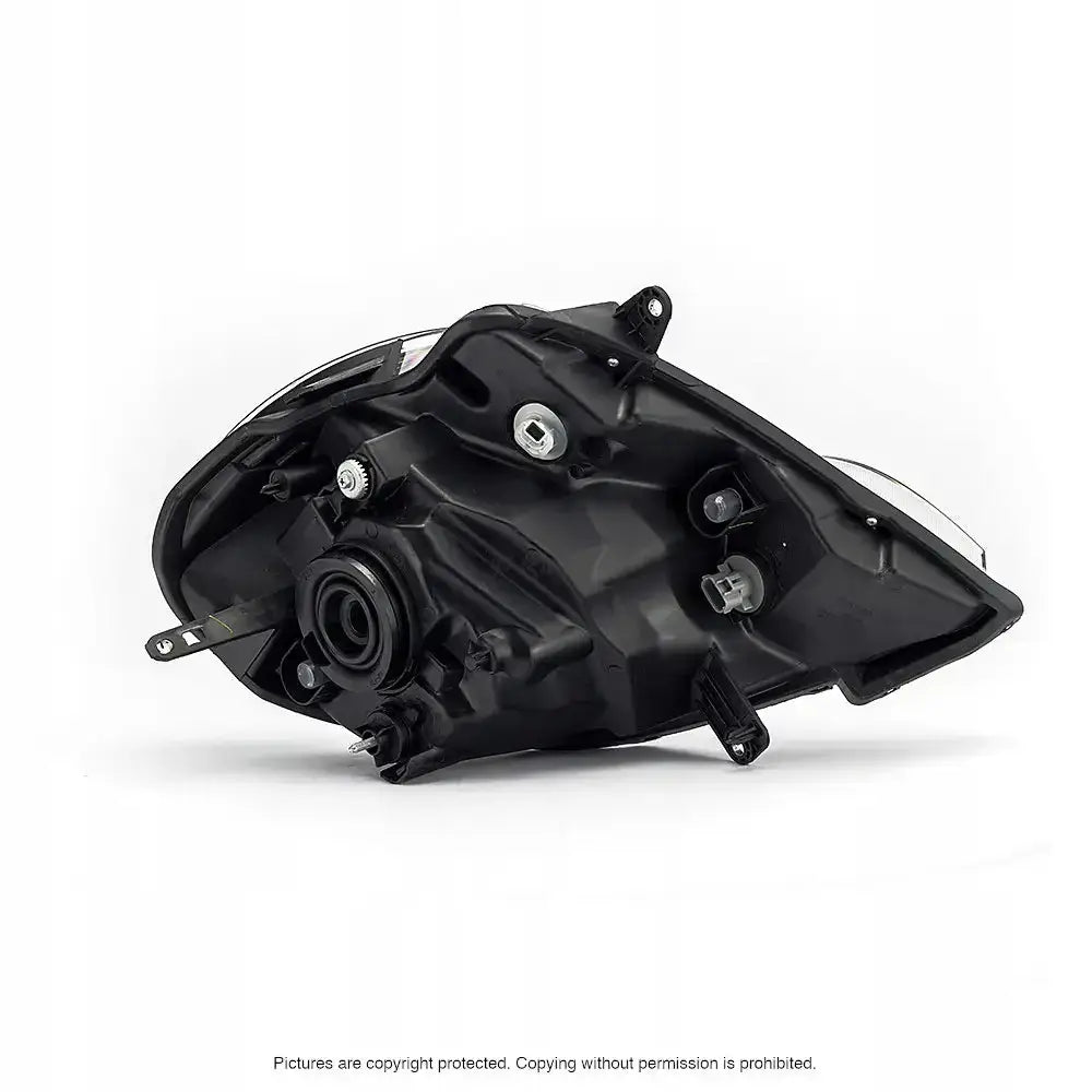 Headlamp bakside av Renault Kangoo 08-13 H4 med monteringspunkter og metalliske detaljer.