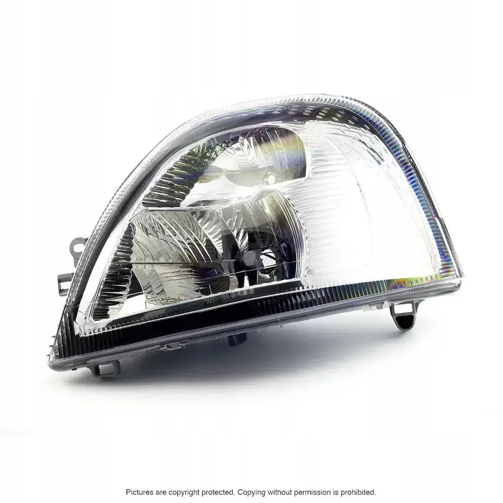 Headlamp Renault Master 04-10 H7 med klar plast, reflekterende overflate og synlige festepunkter.