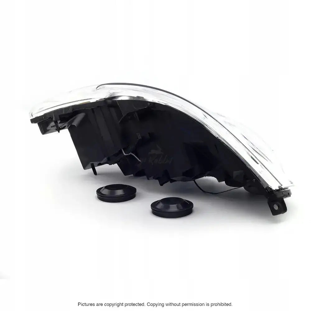 Headlights Renault Master 10- H1/H7 sett fra siden med to runde deksler foran produktet.