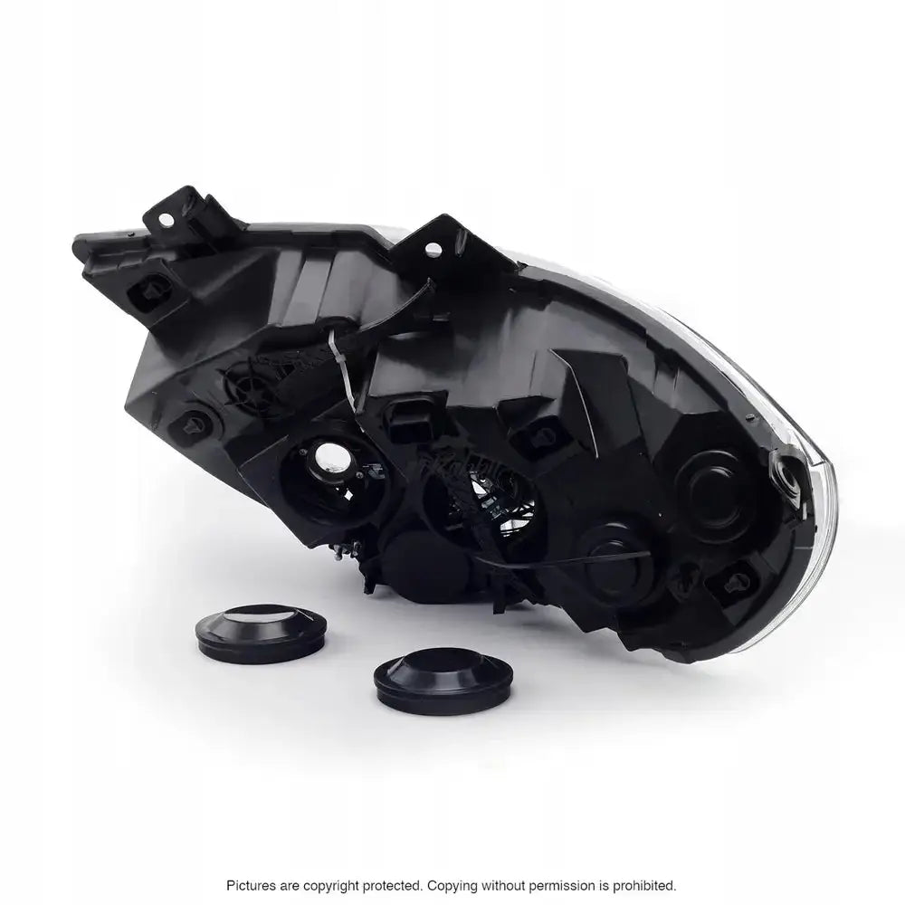 Headlamp bakside av svart plastlykt til Renault Master 10-, med to runde deksler og synlige festepunkter.