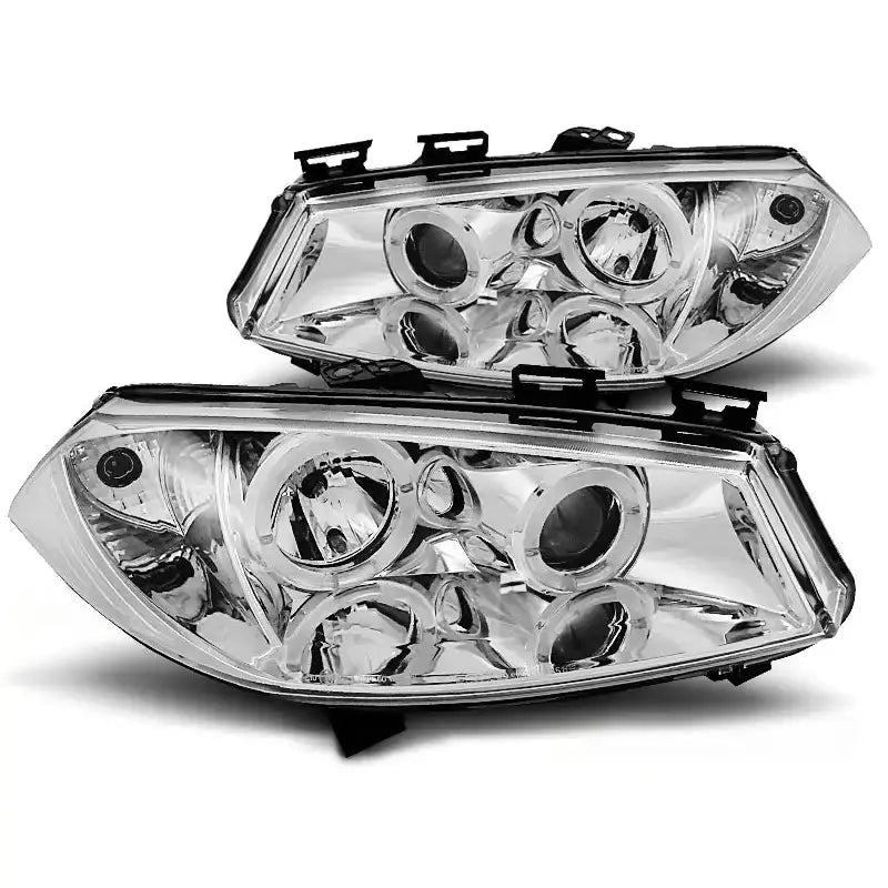 Hovedlykter Renault Megane II Angel Eyes Chrome vist fra skrå vinkel med synlige reflektorer.