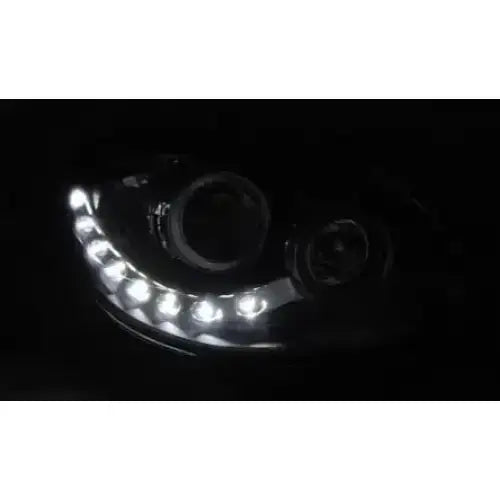Hovedlykter Renault Twingo 07-11 Daylight Black med buede hvite LED-lys synlig i mørket.