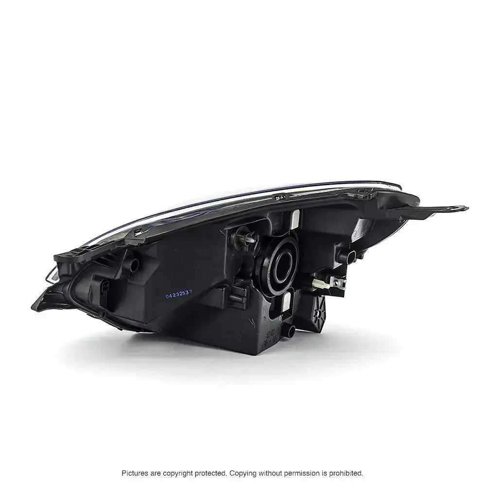 Headlamp bakside av Renault Twingo 11-14 billykt med tydelig monteringstilkobling og plastdetaljer.