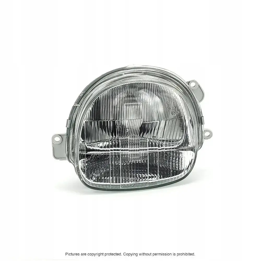 Hovedlykter Renault Twingo 93-98 H4 sett forfra med klart rillet glass og to festebraketter.