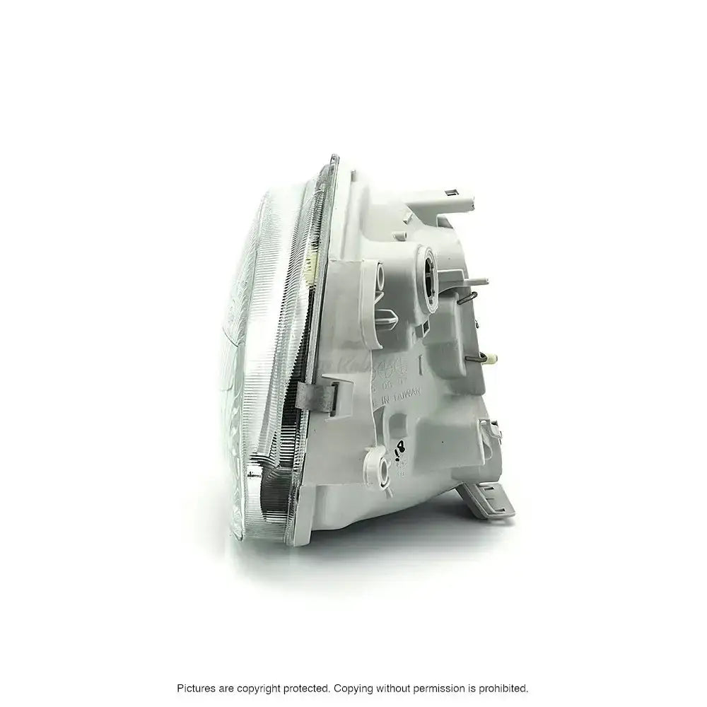 Headlights Renault Twingo 93-98 H4 sett fra siden med synlige festepunkter og tilkoblinger.