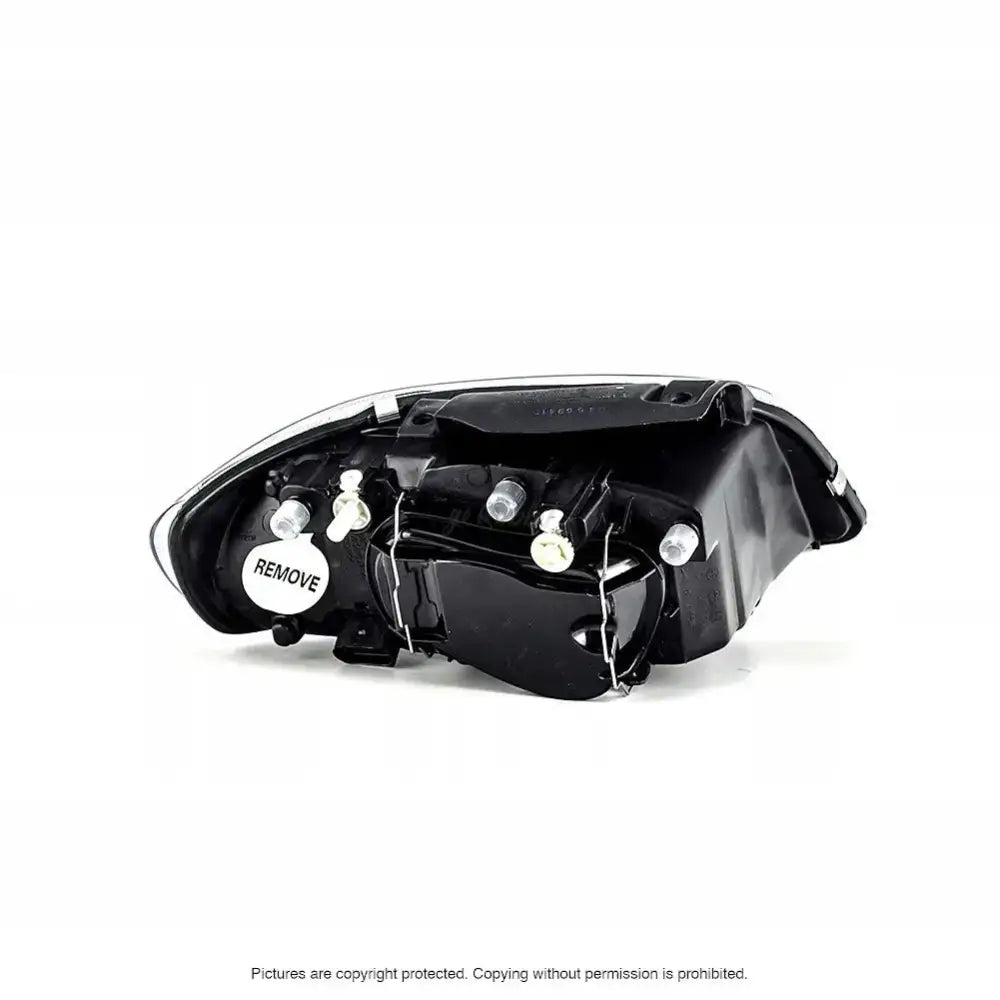 Frontlykter Seat Cordoba 1 99-02 sett bakfra med synlige lyspærer og hvit etikett på plast- og metalldeler.