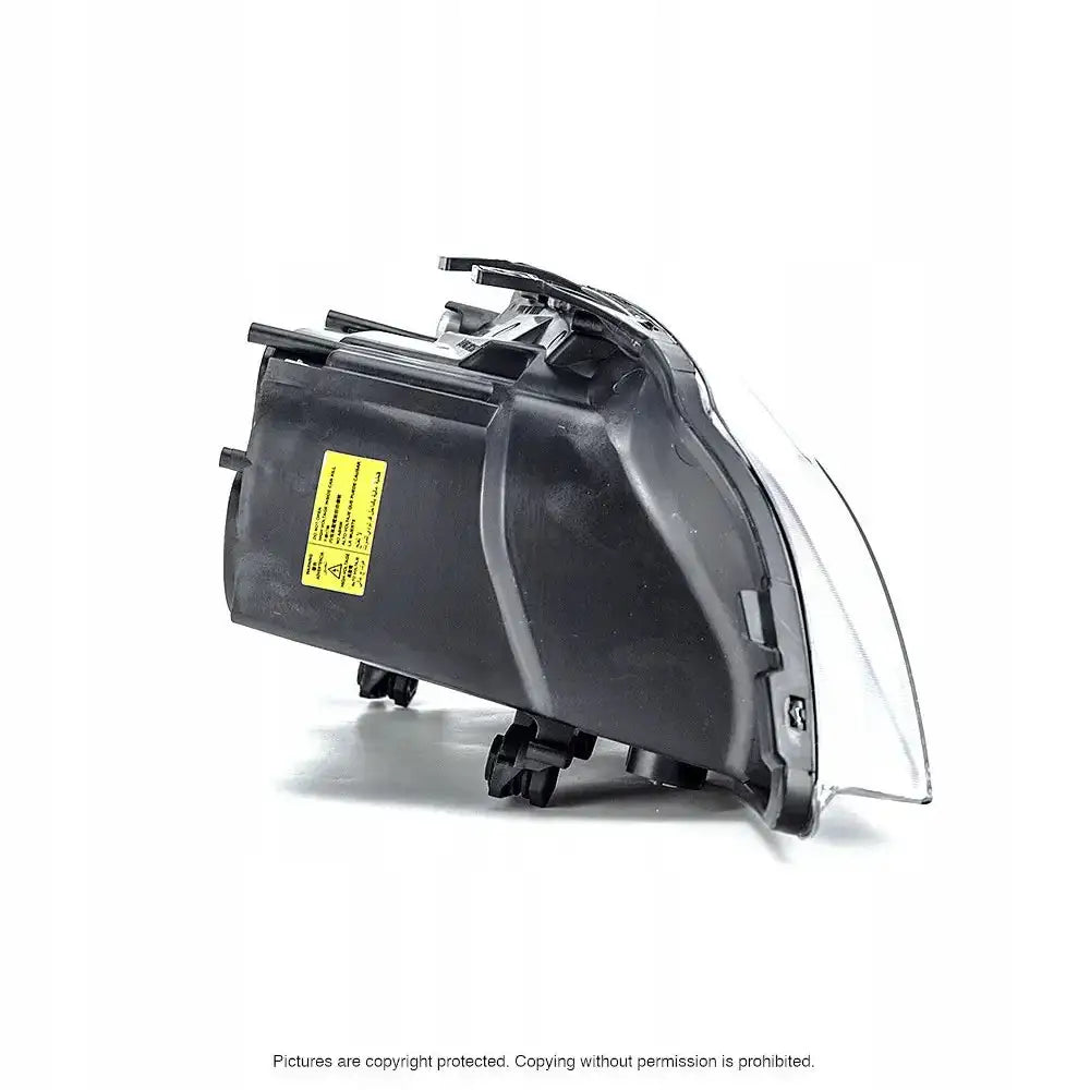 Headlamp til Seat Ibiza 3 02-09 H7, bakside med sort plast og gul sikkerhetsmerking.