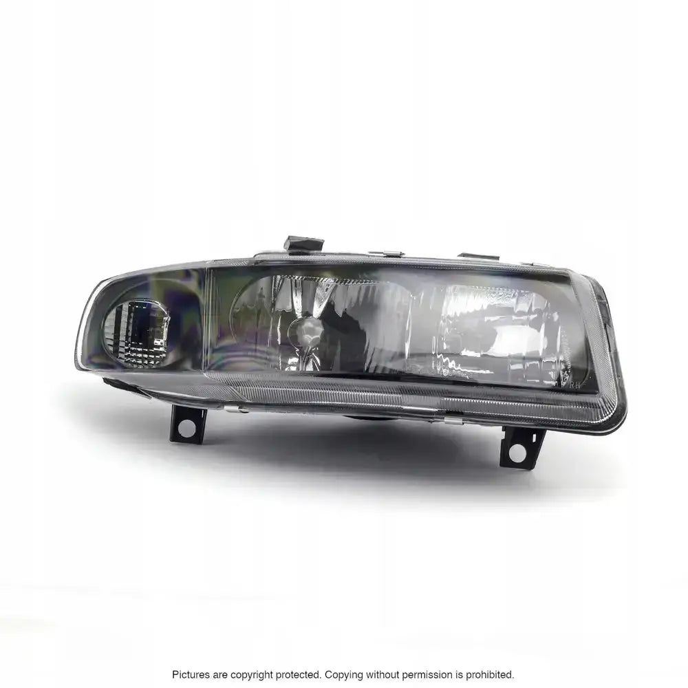 Hovedlys Seat Leon 98-06 rektangulær billykt med klare reflektorer og synlige lyspærer forfra.