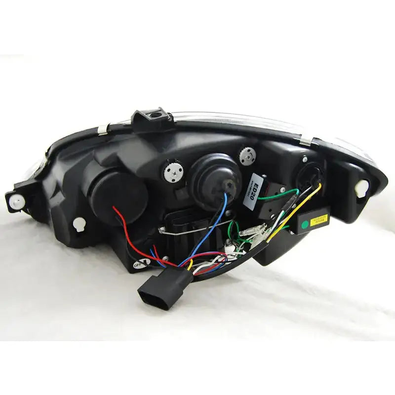 Hovedlys Seat Leon Altea 09-13 chrome sett bakfra med synlige ledninger og elektriske komponenter.