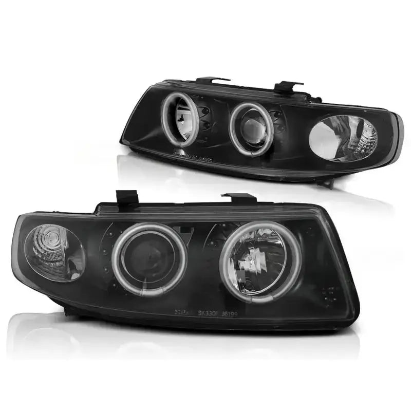 Hovedlykter Seat Leon Toledo 04.99-08.04 i svart med doble runde lys og reflekterende detaljer.