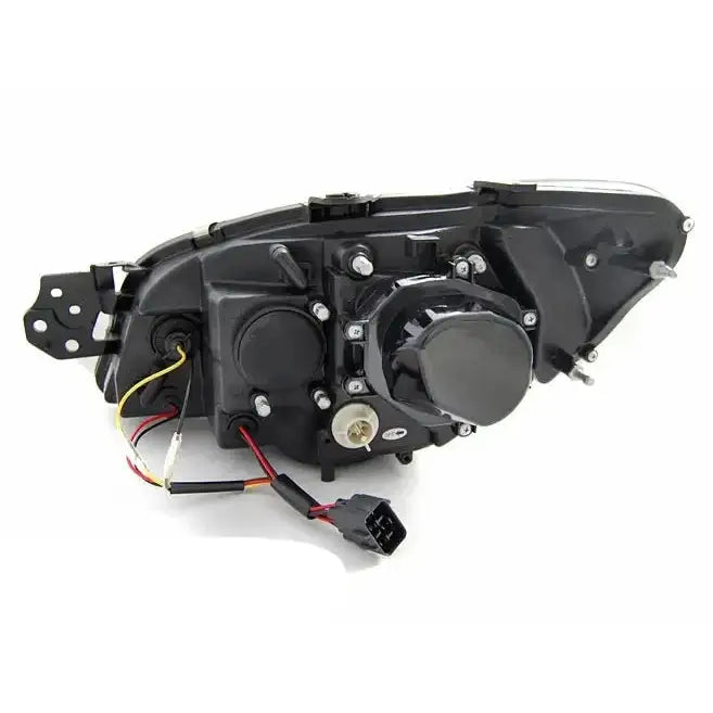 Headlights Subaru Impreza II GD 06-07 Tube Light Black sett bakfra med ledninger og festeskruer.