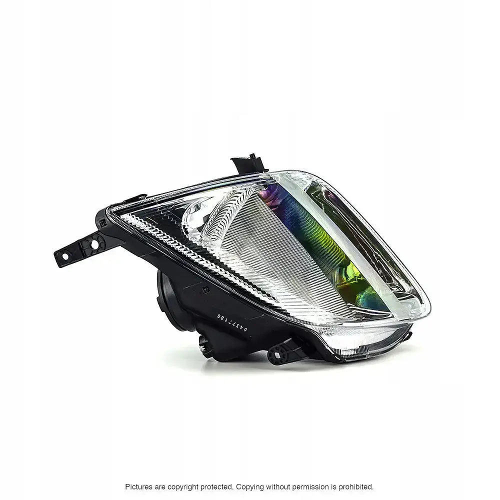 Frontlykter Suzuki Ignis II 03-07 i klart glass og sort plast, sett skrått mot venstre med reflekser.