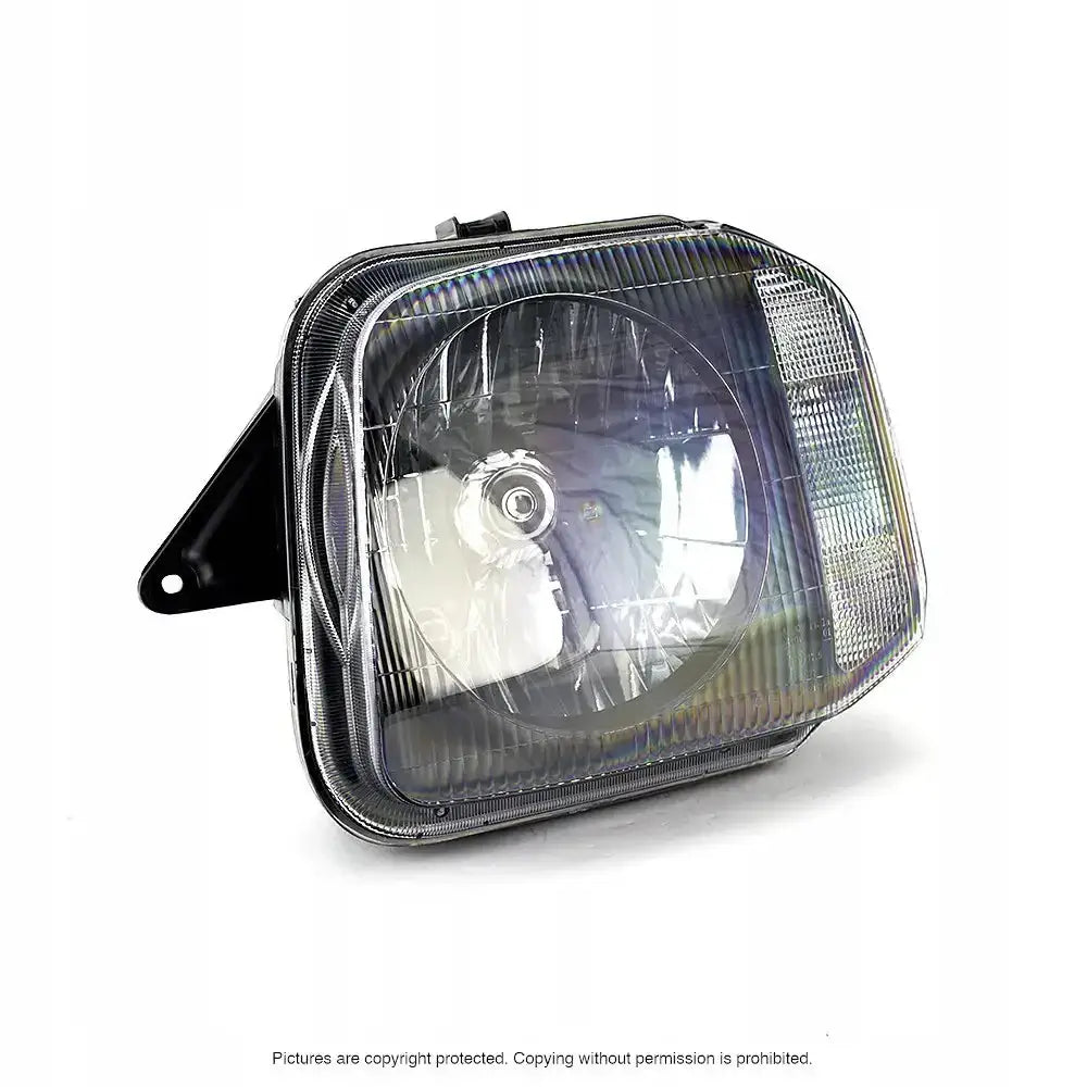 Hovedlykter Suzuki Jimny 98-05 H4 sett fra siden med klart glass og sort monteringsfeste.