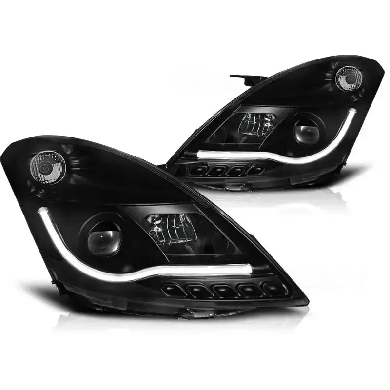 Hovedlykter Suzuki Swift IV Tube Light Black med LED-lysstripe og detaljerte reflektorer i svart finish.