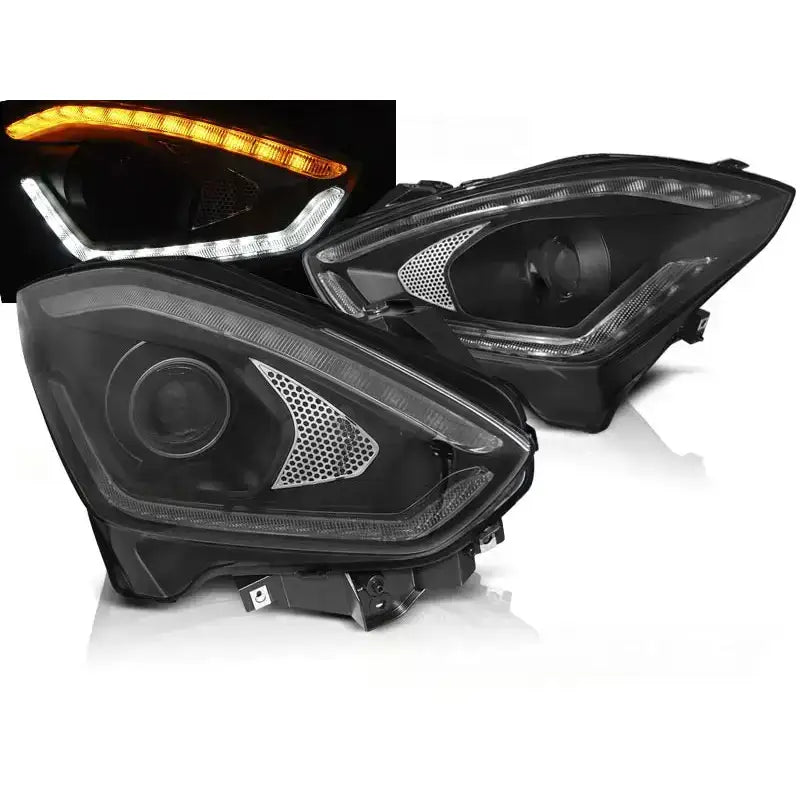 Frontlykter Suzuki Swift VI 17- Tube Light SEQ Black med LED og sølvdetaljer, tent i hvitt og oransje.