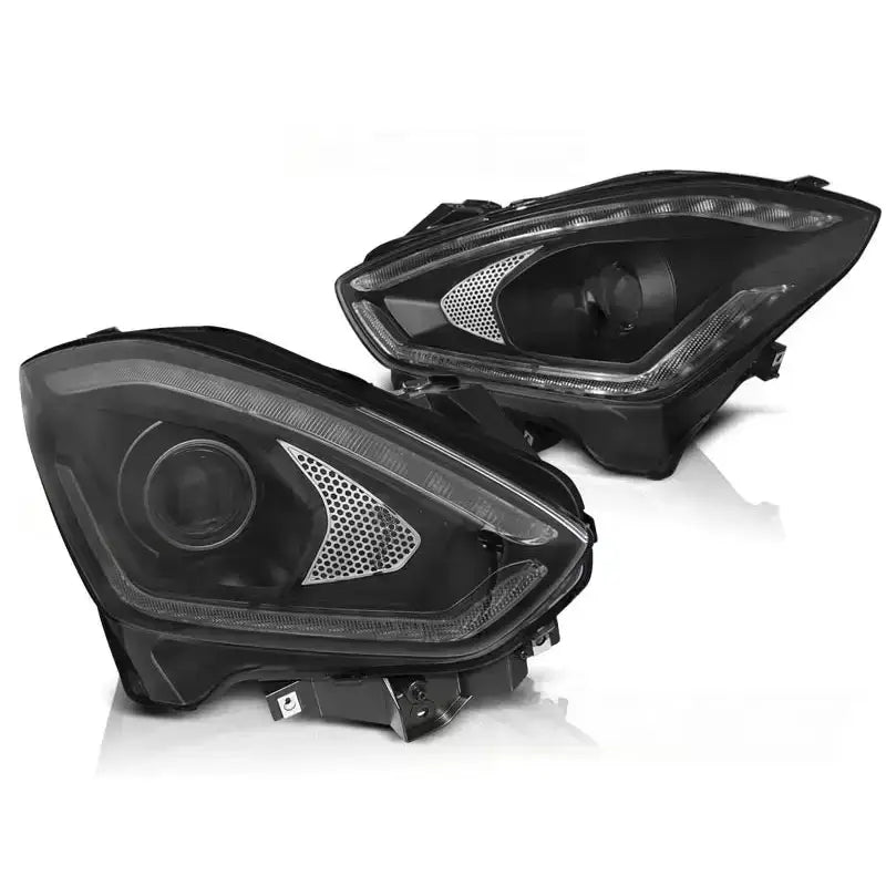 Hovedlykter Suzuki Swift VI 17- Tube Light SEQ Black med LED-striper og sølvdetaljer, skrå vinkel.