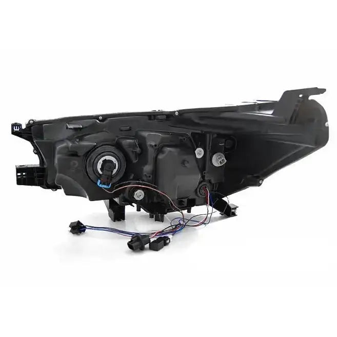 Headlamp bakside av Toyota Hilux 16- LED frontlykt med synlige ledninger og festepunkter.