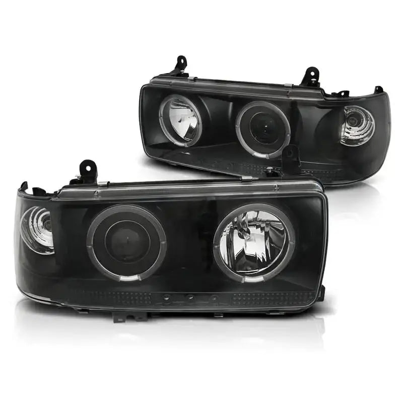 Hovedlykter Toyota Land Cruiser FJ 80 Black med sorte innfatninger og klart glass sett forfra.