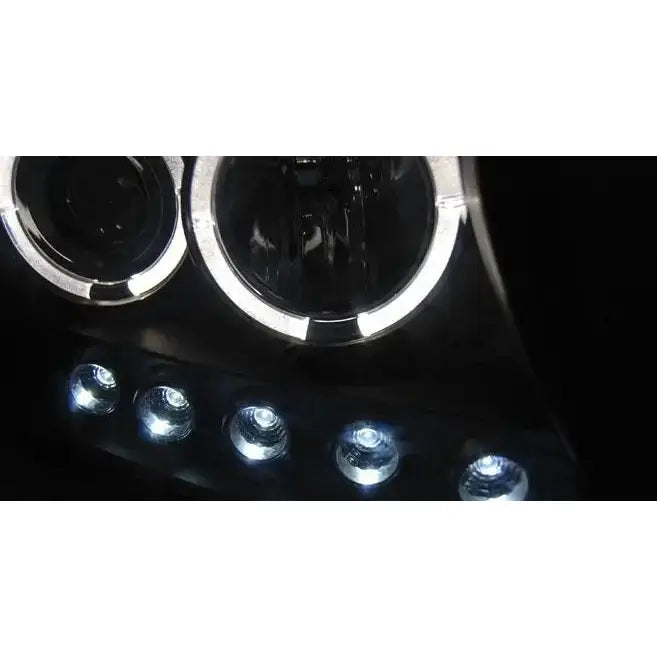 Headlights Toyota Land Cruiser FJ200 Angel Eyes Black med klare linser og fem hvite LED-lys mot mørk bakgrunn.
