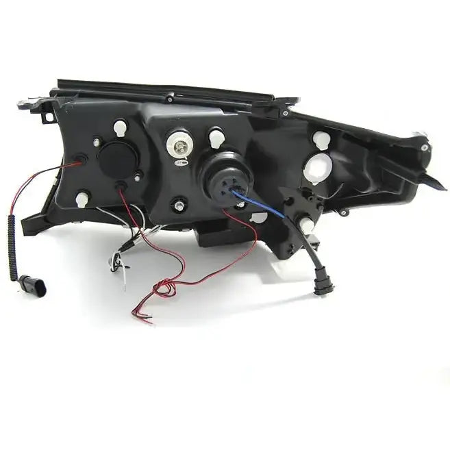 Headlamp bakside av Toyota Land Cruiser FJ200 Angel Eyes Black med ledninger og monteringspunkter.
