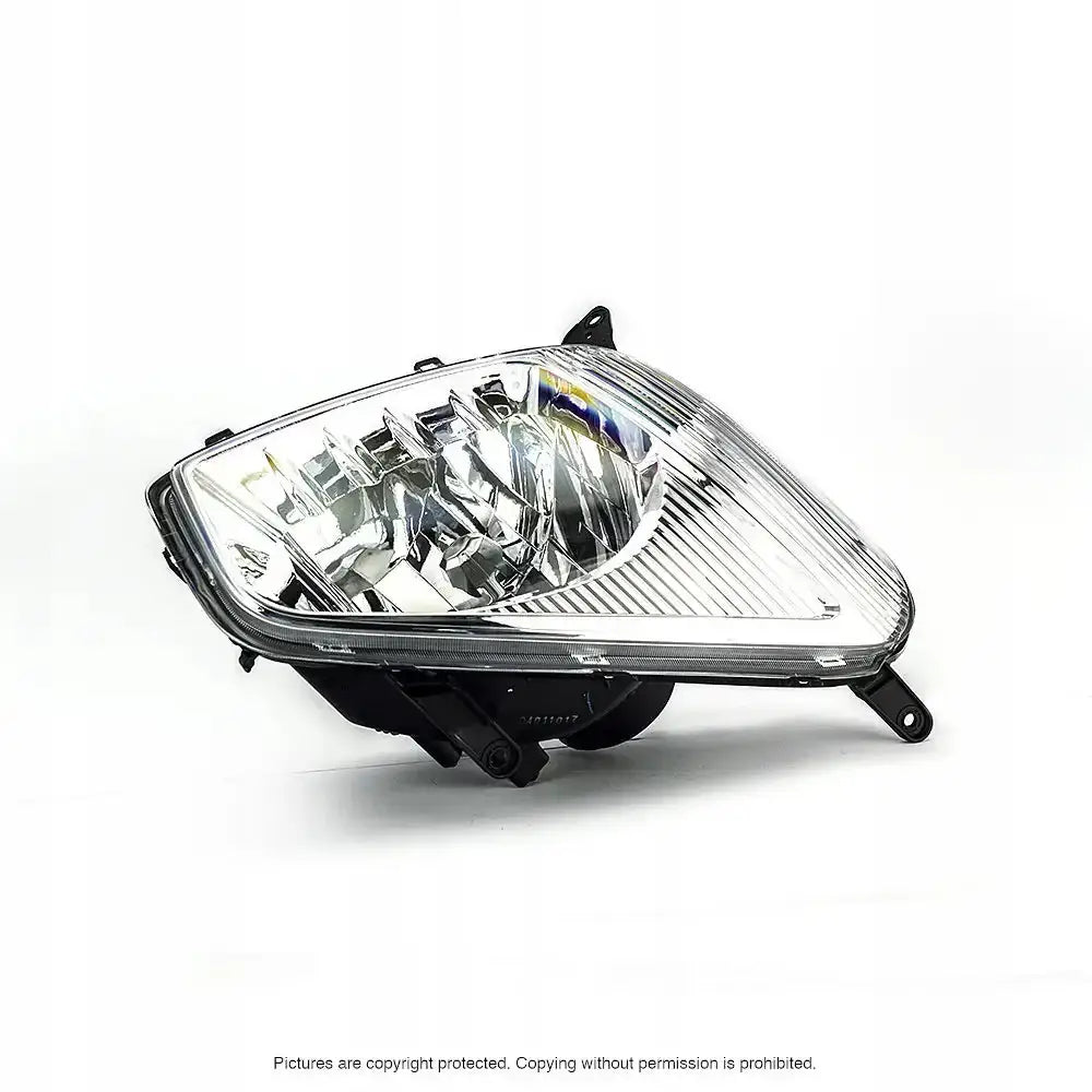 Frontlykter Toyota Rav4 00-03 i klart plast med sorte detaljer, vist fra skrå vinkel mot hvit bakgrunn.