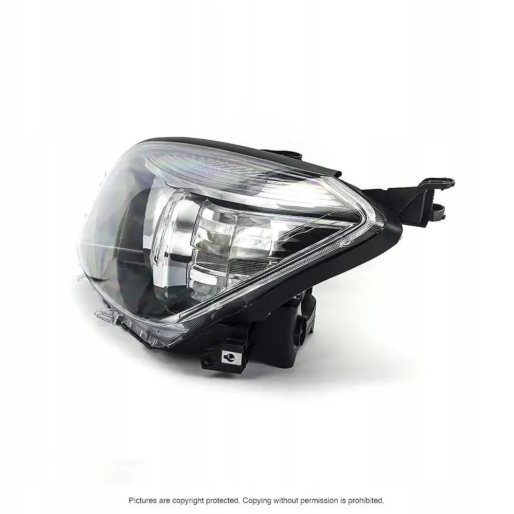 Headlights Toyota Rav4 05-09 i klart glass og svart plast, skrå sidevisning med reflektorer.