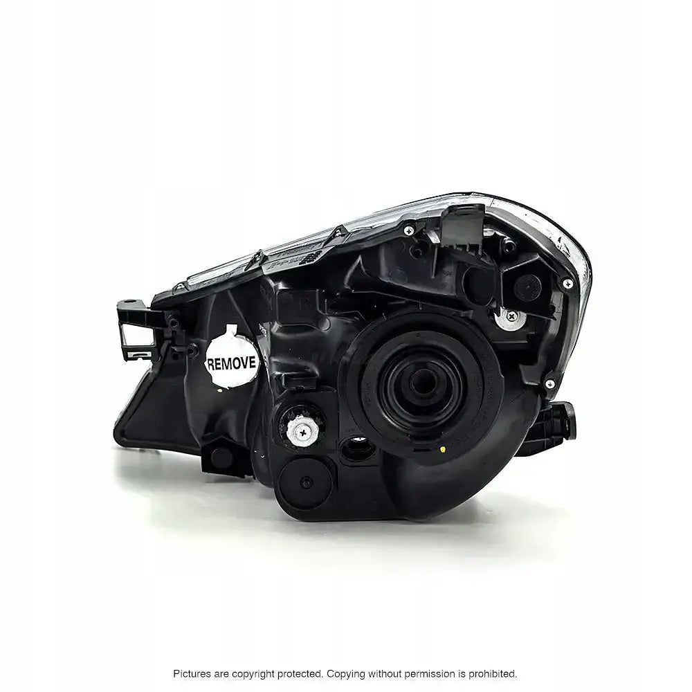 Headlights bakside av Toyota Yaris 10-14 frontlykter med festepunkter og "REMOVE"-etikett.