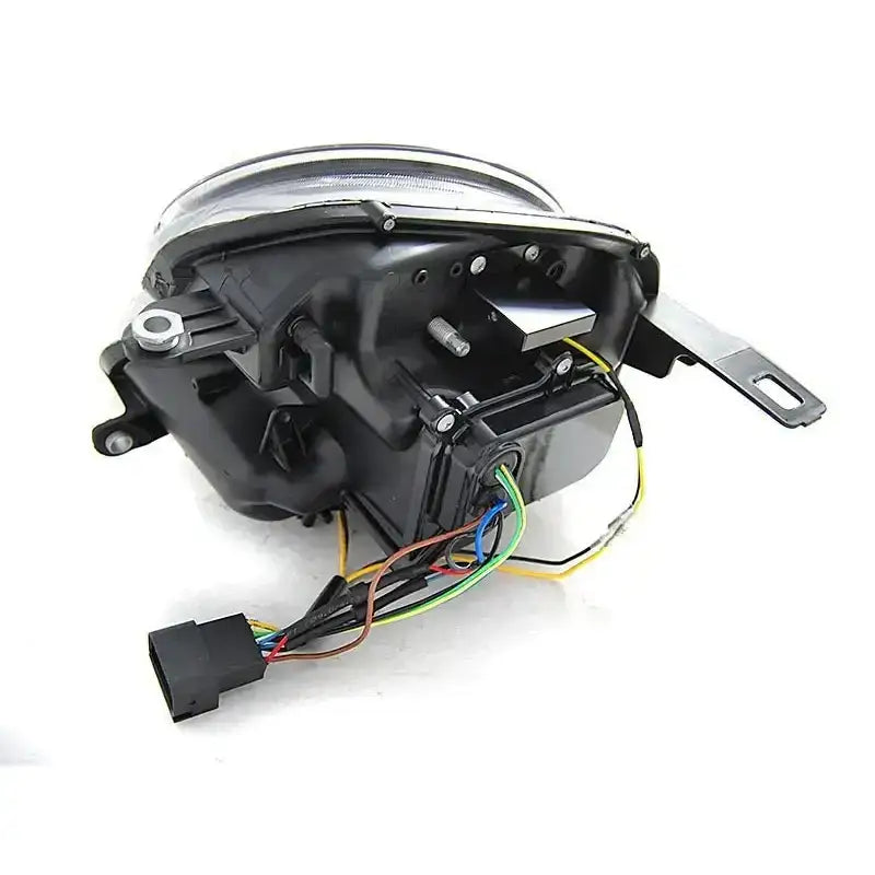 Hovedlykter Tube Light Black for Mini Cooper 06-14, bakside med ledninger og stålbeslag synlig.