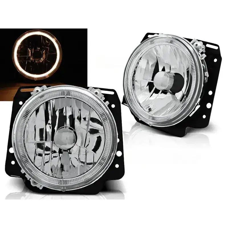 Frontlykter Volkswagen Golf II Angel Eyes Chrome med klar linse og LED-lysring tent i mørket.