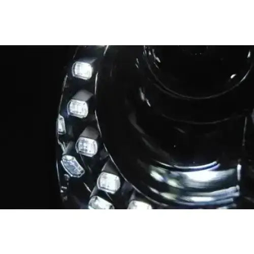Hovedlykter Vw Beetle 06-12 LED Chrome med klare LED-lys i ring på sort, blank overflate.