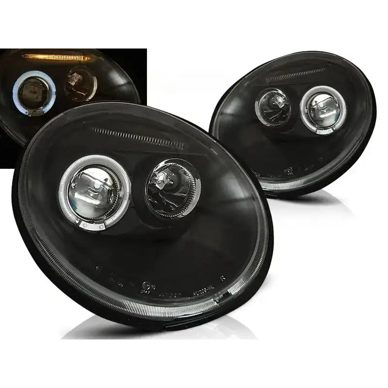 Frontlykter Vw Beetle Angel Eyes Black med sotet glass og synlig LED-ring, sett fra skrå vinkel.