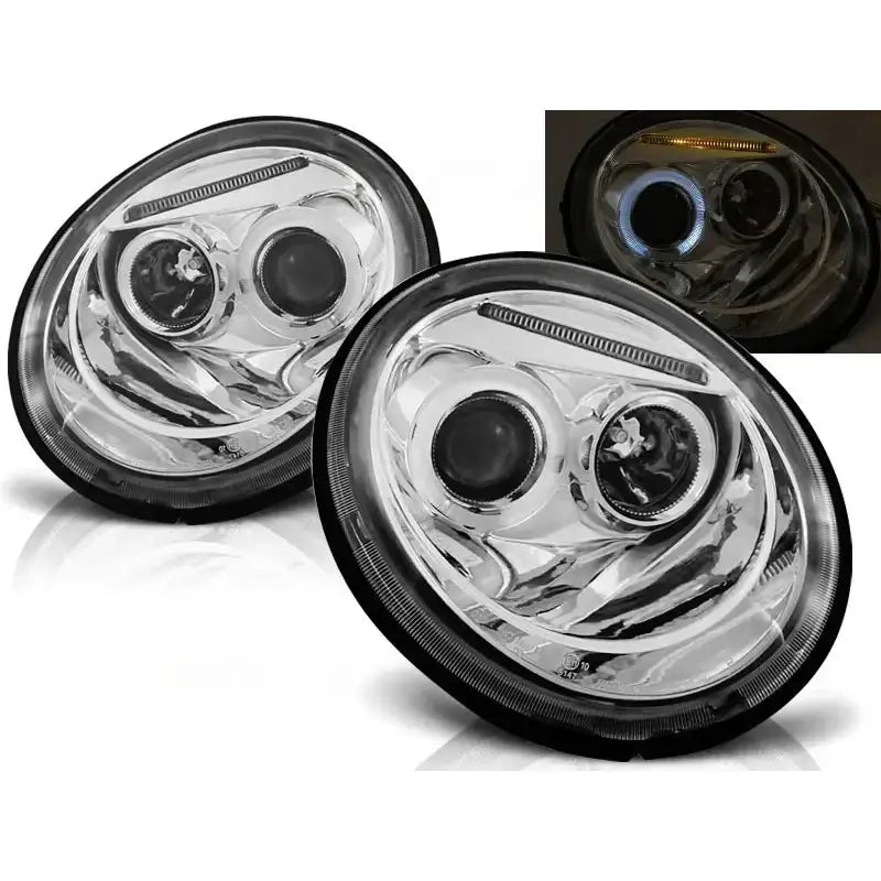 Frontlykter Vw Beetle Angel Eyes Chrome med ovalt design og kromdetaljer, tent med blå og gult lys.