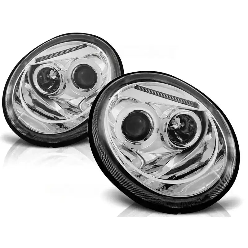 Hovedlykter Vw Beetle Angel Eyes Chrome, to ovale lykter med kromdetaljer og svarte kanter mot hvit bakgrunn.