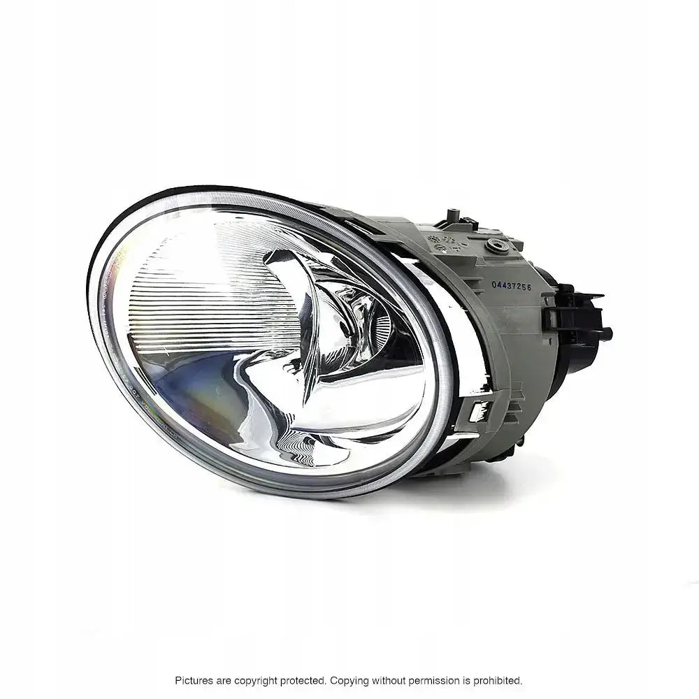 Headlights Vw Beetle 98-05 H1 ovalt frontlykt i klart glass med sølvreflektor, skrå forfra.