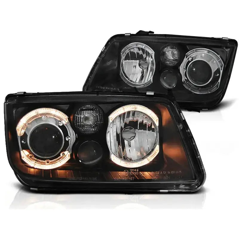Hovedlykter Vw Bora Angel Eyes Black med LED-lysringer, sett fra front og side mot hvit bakgrunn.